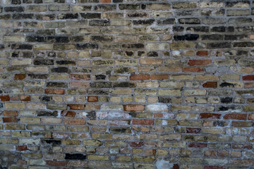 Grungy brick wall with multiple colors