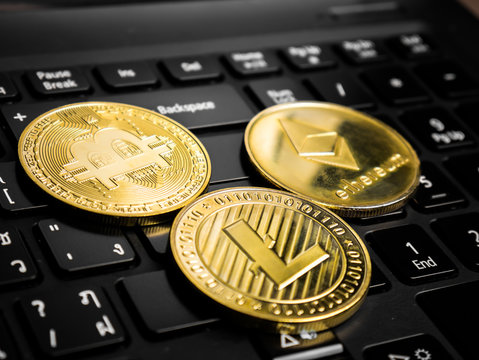 Cryptocurrency coins on the black keyboard.