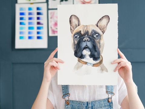 creative leisure. painting hobby. artful personality. talented girl holding her watercolor drawing of french bulldog