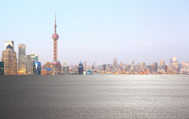 Empty road surface floor with city landmark buildings of Shanghai Skyline