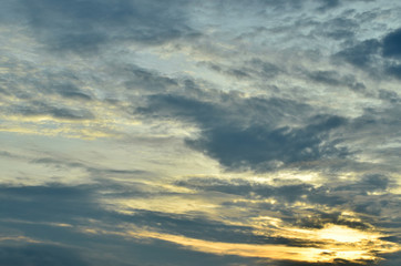 Obraz premium Sky and black clouds on the day of thunderstorms. Shines orange on the clouds