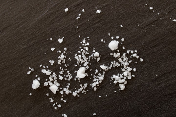 Close up white salt on a black background