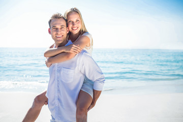  Happy couple having fun on the beach