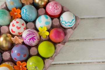 Fototapeta na wymiar Painted Easter eggs in the nest