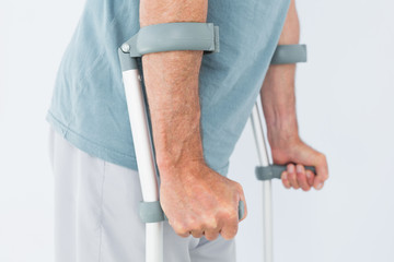 Fototapeta na wymiar Closeup mid section of a man with crutches