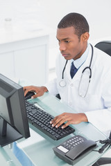 Doctor using computer at medical office