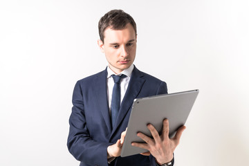 Young businessman holding a tablet PC.