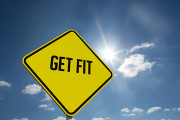 The word get fit and hexagon sign against cloudy sky with sunshine