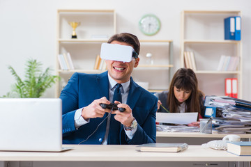 Employee with virtual reality glasses in office