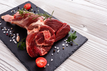 fresh lamb meat on a textured stone plate