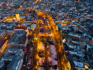 aerial view of city in night time. streets in car lights.