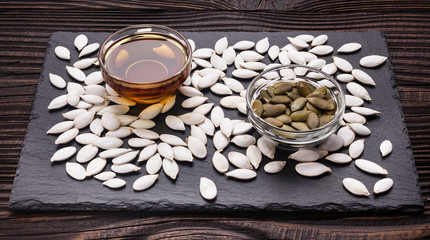 pumpkin seed oil on a rustic background