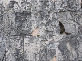 Fragment of ancient mayan stony relief with pictograph at ruins of Chichen atza city in Mexico
