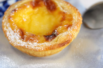 Pasteis de Belem is a typical Portuguese egg tart pastries are baked  since 1837. Even today, Pastel de nata cake make using traditional methods and according to the Jeronimos Monastery secret recipe