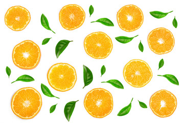 Slices of orange or tangerine decorated with green leaves isolated on white background, top view. Fruit composition