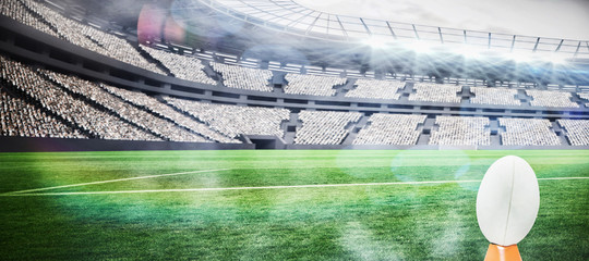 rugby ball against rugby stadium © vectorfusionart