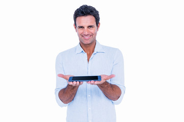 Handsome man showing his tablet computer 