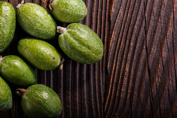 fresh fruits of the feijoa on the rustic background