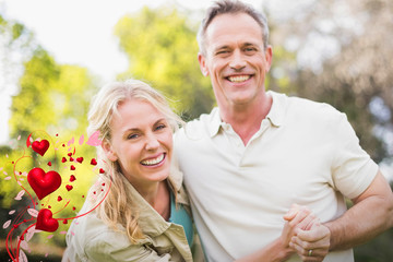 Valentines heart design against happy couple dancing and holding hands 3d