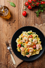 Traditional Italian fettuccini with salmon, shrimp and spinach.
