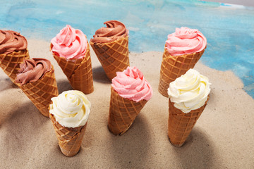 Vanilla frozen yogurt or soft ice cream in waffle cone.