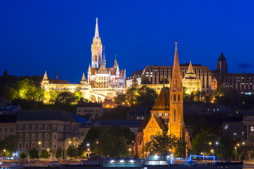 Fototapeta na wymiar Fisherman's Bastion and Calvinist Church at night, Budapest, Hungary