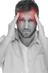 Handsome model having headache on white background