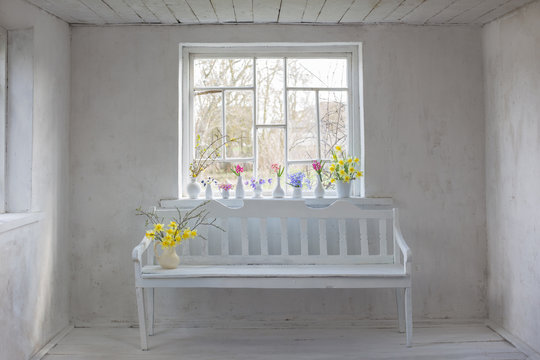 beautiful spring flowers in white vintage interior