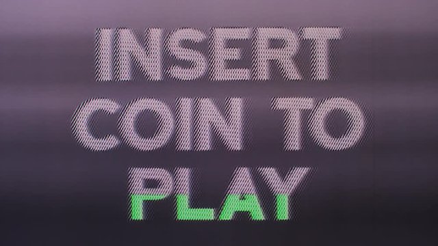insert coin to play words from retro computer arcade game
