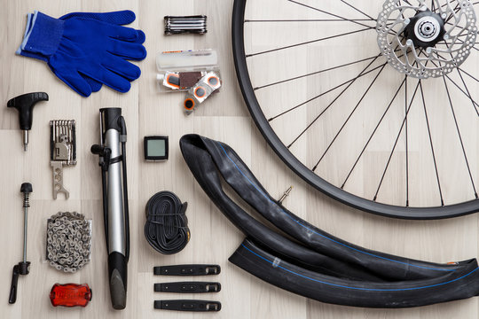 Image of bicycle objects on wooden background.
