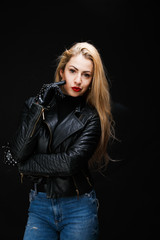 Obraz na płótnie Canvas Photo of young blonde in leather jacket