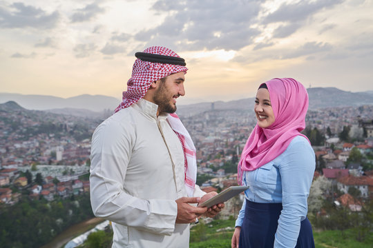 Muslim couple using tablet