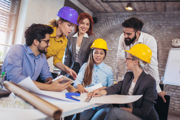 Meeting the team of engineers working on a construction project at the table