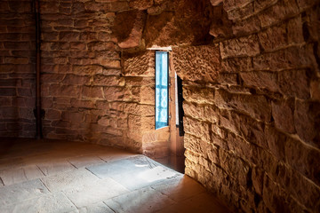 Sunlight shines through the window of an old castle