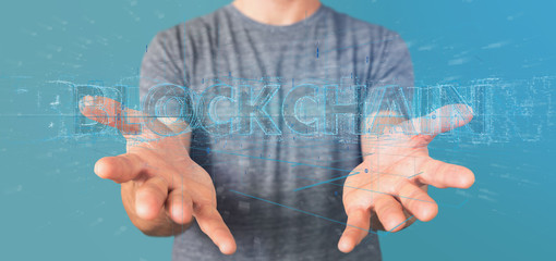 Man holding a Blockchain title isolated on a background