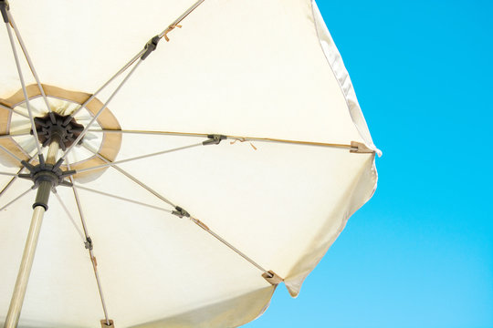 Umbrella and blue summer sky


