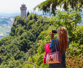 Tourists take pictures of the castle of San Marino