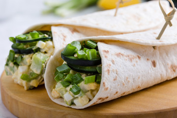 Egg salad and avocado wraps, Mexican style breakfast