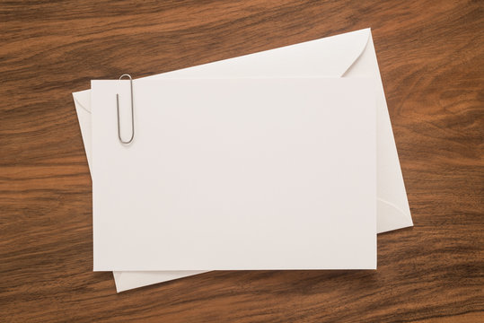 White envelope on wooden background 