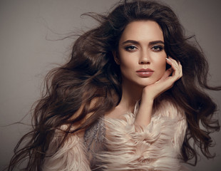 Beauty fashion brunette portrait. Sexy woman wears in stylish fur coat. Beautiful girl model with...
