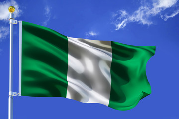 The silk waving flag of Nigeria with a flagpole on a blue sky background with clouds .3D illustration..