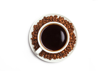 Coffee beans and coffee in a white cup isolated on white background.