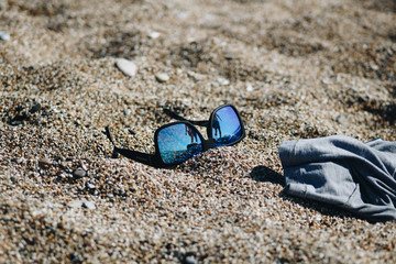 Sunglasses on sand 