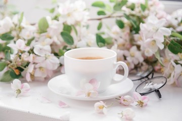 Fototapeta na wymiar cup of morning coffee with flowers