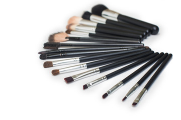 makeup brushes on isolated white background