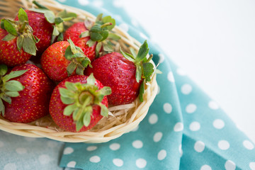 Close-up of fresh strawberries in wicker tray