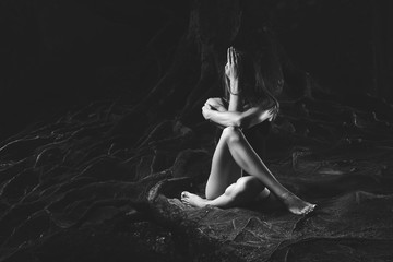 Young woman practicing yoga outdoors