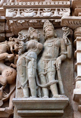 Shiva and Parvati - ancient bas-relief at famous ancient temple in Khajuraho, India