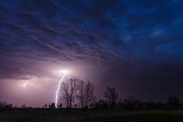 Lightning strike under dramatic sky