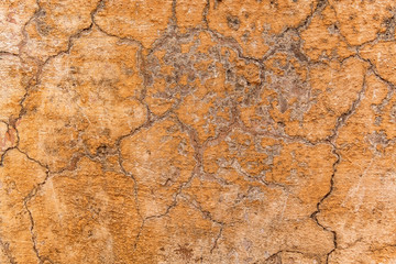 Brown adobe clay wall texture background. Material construction. Architectural detail. Vernacular...